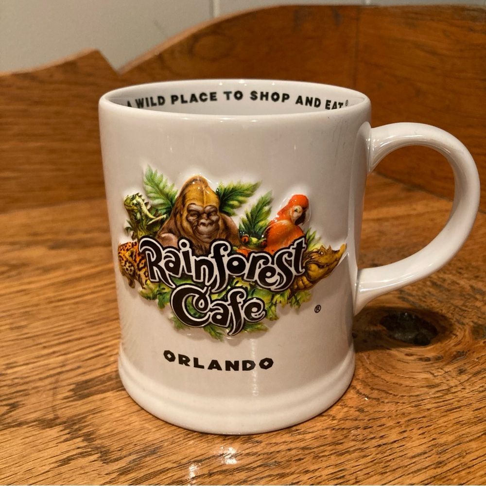 RAINFOREST Cafe Orlando Ten Wild Years White Mug with Colorful Jungle Design